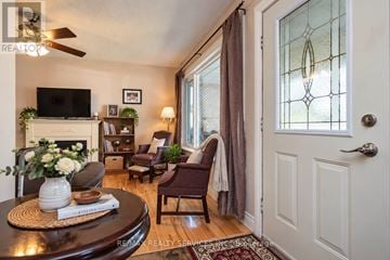 Cambridge apartment for rent - A living room with a fireplace, a chair, and a table.