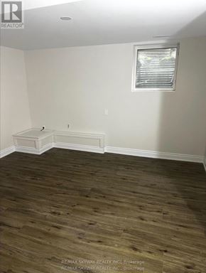 Waterloo apartment for rent - A room with a window and a wooden floor.