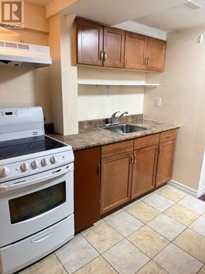 Toronto (Rouge) apartment for rent - A kitchen with a white stove and wooden cabinets.
