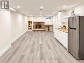 Toronto (L'amoreaux) apartment for rent - A kitchen with a refrigerator on the right side.