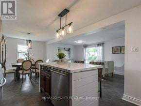 Quinte West (Trenton Ward) apartment for rent - A modern kitchen with a dining table and chairs.