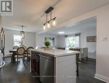 Quinte West (Trenton Ward) apartment for rent - A modern kitchen with a dining table and chairs.