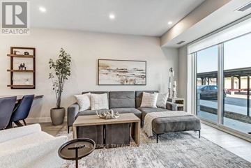 Central Elgin (Port Stanley) multi-family for rent - A living room with a grey couch and a coffee table.