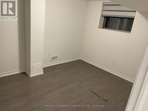 Brampton (Credit Valley) apartment for rent - A room with a window and a wooden floor.