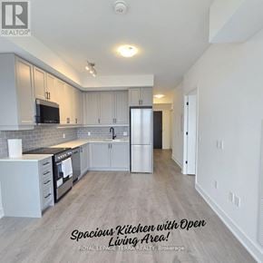 Oakville (Wm Westmount) condo for rent - A spacious kitchen with an open living area.