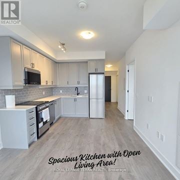 Oakville (Wm Westmount) condo for rent - A spacious kitchen with an open living area.