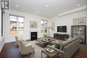 East Gwillimbury (Holland Landing) apartment for rent - A living room with a fireplace and a flat screen TV.