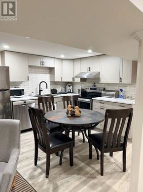 Vaughan (West Woodbridge) apartment for rent - A modern kitchen with a table set for four.