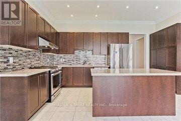 Markham (Cachet) apartment for rent - A kitchen with brown cabinets and a stone backsplash.