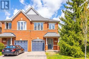 Mississauga (Churchill Meadows) apartment for rent - A house with a car parked in front of it.