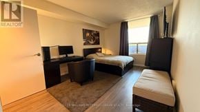 Mississauga (Lakeview) condo for rent - A bedroom with a bed, desk, and chair.