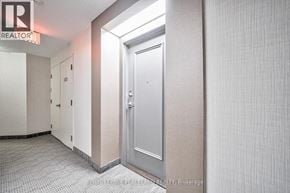 Toronto (Niagara) condo for rent - A hallway with a door and a sign that says REALTOR.