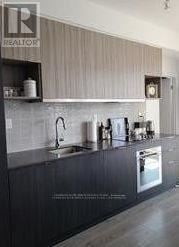 Toronto (Banbury-Don Mills) condo for rent - A kitchen with a sink and a dishwasher.