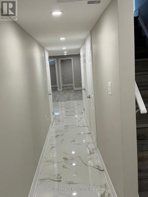 Mississauga (Churchill Meadows) apartment for rent - A hallway with marble flooring and white walls.