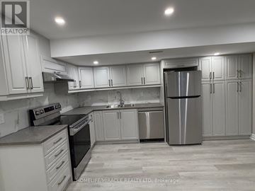 Mississauga (Churchill Meadows) apartment for rent - A kitchen with white cabinets and stainless steel appliances.