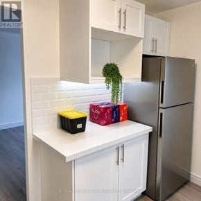 Toronto (Ionview) condo for rent - A kitchen with a white countertop and a refrigerator.