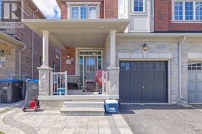 Brampton (Bram East) apartment for rent - A house with a covered patio and a blue cooler on the steps.