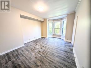 London East (East K) multi-family for rent - A room with a window and a sliding door.