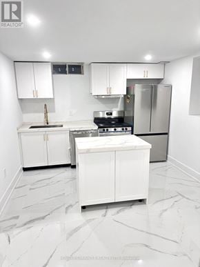 Whitby (Williamsburg) apartment for rent - A white kitchen with a marble floor and a refrigerator in the corner.