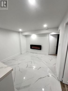 Whitby (Williamsburg) apartment for rent - A white marble floor in a room with a fireplace.