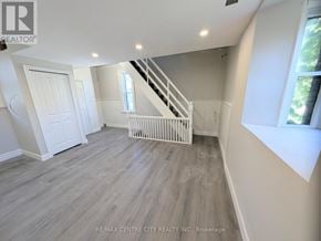 London East (East K) multi-family for rent - A room with a white door and a window with a white frame.