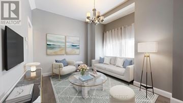 Collingwood duplex for rent - A living room with a white sofa, a glass coffee table, and a painting on the wall.