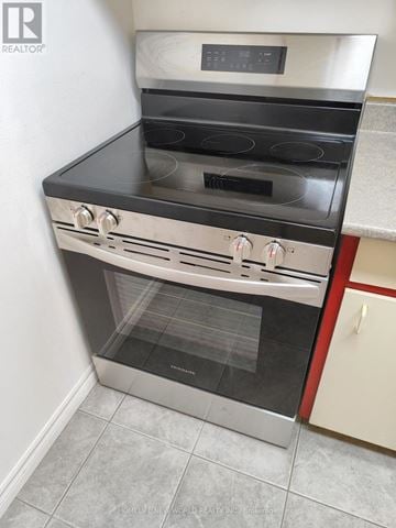 Windsor condo for rent - A modern stainless steel oven with a digital control panel is installed in a kitchen.