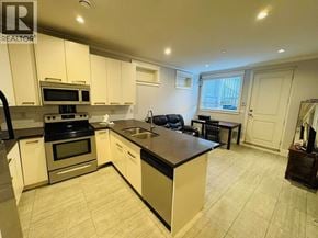 Vancouver apartment for rent - A kitchen with a black countertop and white cabinets.