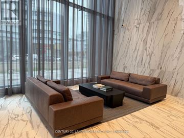 Mississauga (City Centre) condo for rent - A living room with a brown couch and a coffee table.