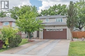 Hamilton (Riverdale) apartment for rent - A house with a brown garage door is for sale.