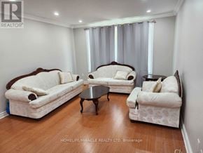Hamilton (Riverdale) apartment for rent - A living room with two couches, a coffee table, and a window with curtains.