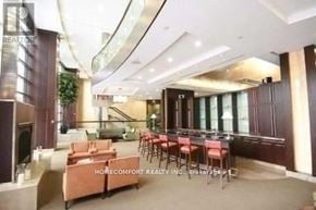 Toronto (Willowdale East) condo for rent - A spacious living room with a staircase and a dining area.