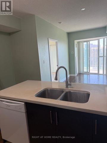Mississauga (City Centre) condo for rent - A kitchen with a sink and a dishwasher.