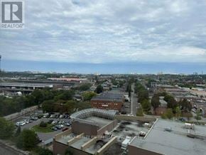 Toronto (Junction Area) condo for rent - A REALTOR® logo is visible on a building in a parking lot.