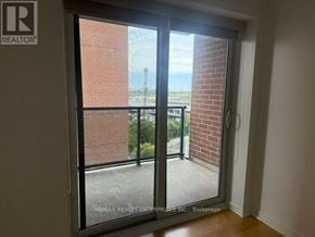 Toronto (Junction Area) condo for rent - A room with a sliding glass door leading to a balcony.