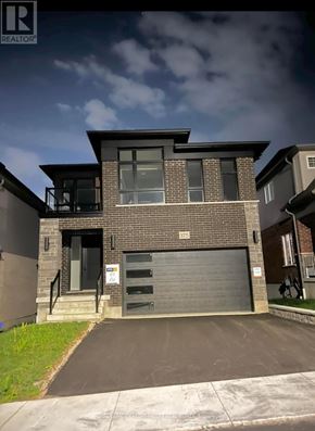 Waterloo apartment for rent - A modern house with a garage door is for sale.