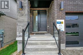 Waterloo apartment for rent - A house entrance with a sign that says 47 and 275.