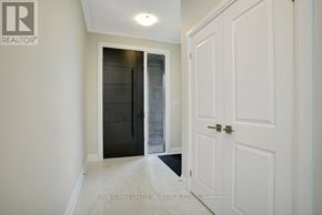 Waterloo apartment for rent - A hallway with a white door and a black door on the other side.