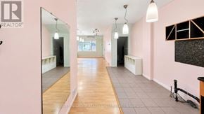 Toronto (Weston-Pellam Park) apartment for rent - A spacious room with a long hallway and a mirror on the left side.