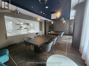 Vaughan (Vaughan Corporate Centre) condo for rent - A modern dining room with a long table and chairs.