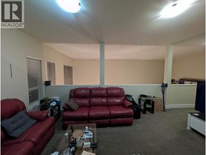 Richmond apartment for rent - A living room with a red couch and a coffee table.