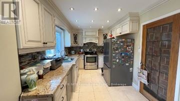 Toronto (Bayview Village) apartment for rent - A kitchen with a refrigerator covered in magnets.