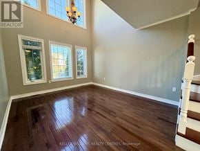 Barrie (400 West) apartment for rent - A room with wooden flooring and a chandelier.