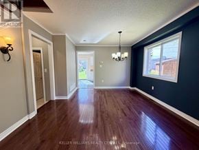 Barrie (400 West) apartment for rent - A room with wood flooring and a chandelier.