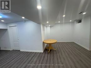Richmond Hill (Westbrook) apartment for rent - A room with a wooden table and grey carpet.