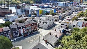 St. John's house for rent - A city street with a mix of old and new buildings.