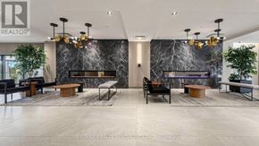 Toronto (Downsview-Roding-Cfb) condo for rent - A modern living room with a black and white marble backdrop and a variety of seating options.