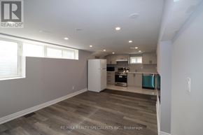 Brampton (Northwood Park) apartment for rent - A spacious room with a kitchen area in the background.