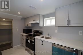 Brampton (Northwood Park) apartment for rent - A kitchen with white cabinets and a stainless steel dishwasher.