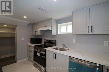 Brampton (Northwood Park) apartment for rent - A kitchen with white cabinets and a stainless steel dishwasher.